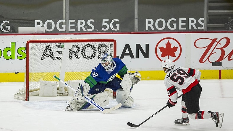 Apr 24, 2021; Vancouver, British Columbia, CAN; Vancouver Canucks goalie Braden Holtby (49) makes a save on a penalty shot attempt taken by Ottawa Senators forward Alex Formenton (59) in the second period at Rogers Arena. Canucks won 4-2.  Mandatory Credit: Bob Frid-USA TODAY Sports