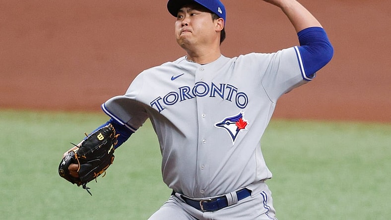 Apr 25, 2021; St. Petersburg, Florida, USA;  Toronto Blue Jays starting pitcher Hyun Jin Ryu (99) throws a pitch in the first inning against the Tampa Bay Rays at Tropicana Field. Mandatory Credit: Nathan Ray Seebeck-USA TODAY Sports