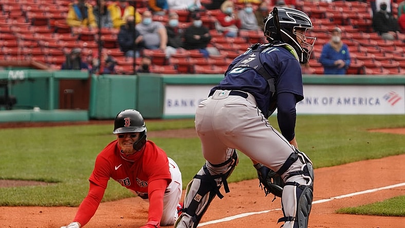 Apr 25, 2021; Boston, Massachusetts, USA; Boston Red Sox second baseman Enrique Hernandez (5) scores against the Seattle Mariners in the first inning at Fenway Park. Mandatory Credit: David Butler II-USA TODAY Sports
