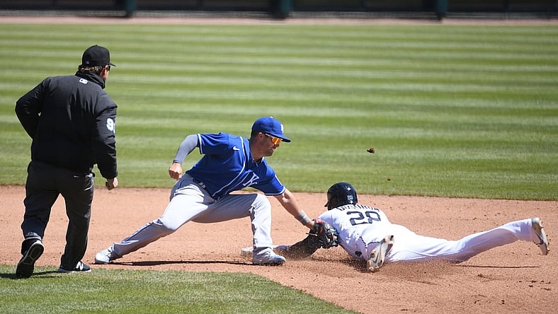 Apr 25, 2021; Detroit, Michigan, USA; Kansas City Royals second baseman Whit Merrifield (15) tags Detroit Tigers third baseman Niko Goodrum (28) out at second base during the fourth inning at Comerica Park. Mandatory Credit: Tim Fuller-USA TODAY Sports