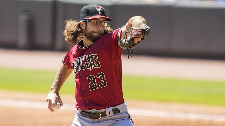 Apr 25, 2021; Cumberland, Georgia, USA; Arizona Diamondbacks starting pitcher Zac Gallen (23) pitches against the Atlanta Braves during the second inning at Truist Park. Mandatory Credit: Dale Zanine-USA TODAY Sports
