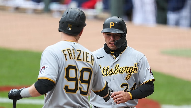 Apr 25, 2021; Minneapolis, Minnesota, USA; Pittsburgh Pirates left fielder Phillip Evans (24) celebrates with designated hitter Todd Frazier (99) after scoring a run against the Minnesota Twins in the first inning at Target Field. Mandatory Credit: David Berding-USA TODAY Sports