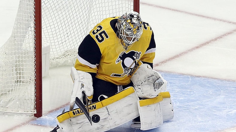 Apr 25, 2021; Pittsburgh, Pennsylvania, USA; Pittsburgh Penguins goaltender Tristan Jarry (35) makes a save against the Boston Bruins during the first period at PPG Paints Arena. Mandatory Credit: Charles LeClaire-USA TODAY Sports