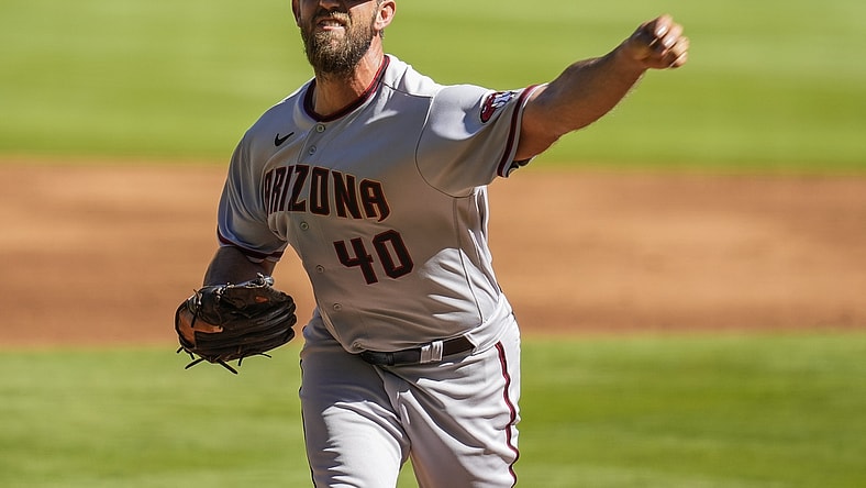 Apr 25, 2021; Cumberland, Georgia, USA; Arizona Diamondbacks starting pitcher Madison Bumgarner (40) pitches against the Atlanta Braves during the first inning at Truist Park. Mandatory Credit: Dale Zanine-USA TODAY Sports