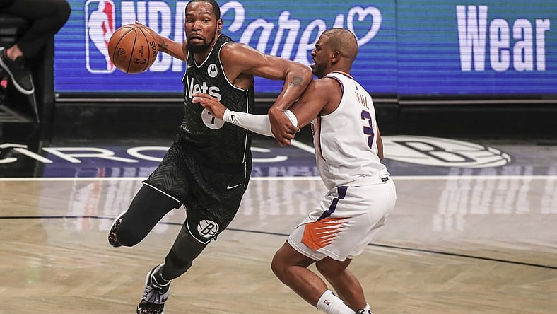 Apr 25, 2021; Brooklyn, New York, USA; Brooklyn Nets forward Kevin Durant (7) drives past Phoenix Suns guard Chris Paul (3) in the third quarter at Barclays Center. Mandatory Credit: Wendell Cruz-USA TODAY Sports