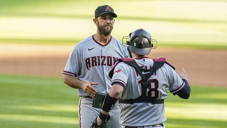Apr 25, 2021; Cumberland, Georgia, USA; Arizona Diamondbacks starting pitcher Madison Bumgarner (40) reacts with teammates after pitching a seven inning no hit no run game against the Atlanta Braves in game two at Truist Park. Mandatory Credit: Dale Zanine-USA TODAY Sports