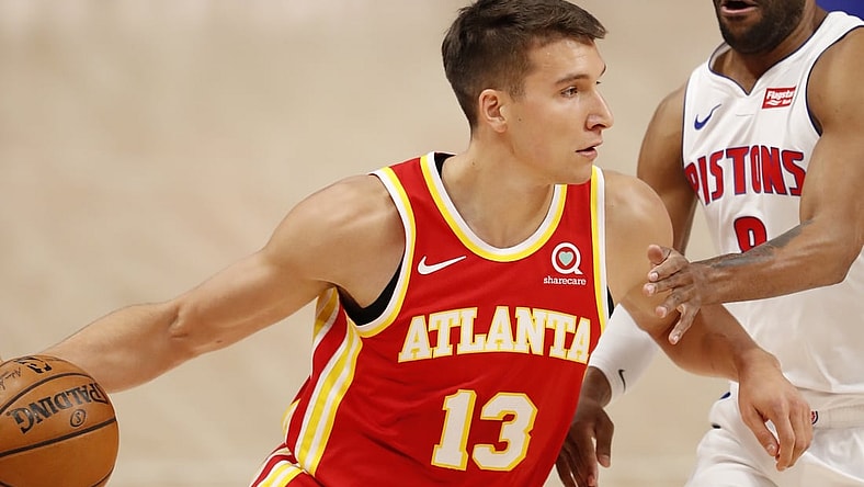 Apr 26, 2021; Detroit, Michigan, USA; Atlanta Hawks guard Bogdan Bogdanovic (13) drives to the basket against Detroit Pistons guard Wayne Ellington (8) during the first quarter at Little Caesars Arena. Mandatory Credit: Raj Mehta-USA TODAY Sports