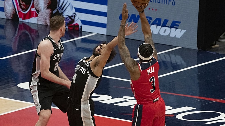 Apr 26, 2021; Washington, District of Columbia, USA;  Washington Wizards guard Bradley Beal (3) shoots over San Antonio Spurs guard Derrick White (4) during the first half at Capital One Arena. Mandatory Credit: Tommy Gilligan-USA TODAY Sports