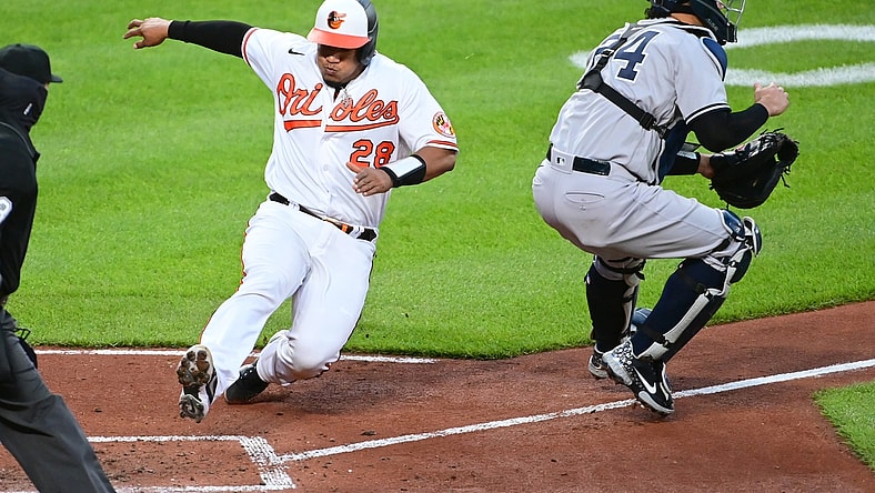Apr 26, 2021; Baltimore, Maryland, USA; Baltimore Orioles catcher Pedro Severino (28) slides home to score a run during the second inning against the New York Yankees at Oriole Park at Camden Yards. Mandatory Credit: Evan Habeeb-USA TODAY Sports