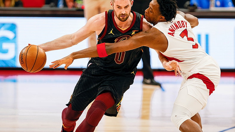 Apr 26, 2021; Tampa, Florida, USA; Toronto Raptors forward OG Anunoby (3) attempts to steal the ball from Cleveland Cavaliers forward Kevin Love (0) in the first quarter at Amalie Arena. Mandatory Credit: Nathan Ray Seebeck-USA TODAY Sports