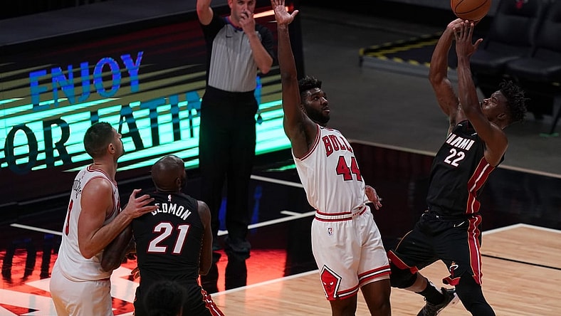 Apr 26, 2021; Miami, Florida, USA; Chicago Bulls forward Patrick Williams (44) fouls Miami Heat forward Jimmy Butler (22) on the shot during the second half at American Airlines Arena. Mandatory Credit: Jasen Vinlove-USA TODAY Sports