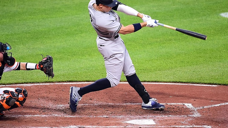 Apr 27, 2021; Baltimore, Maryland, USA; New York Yankees outfielder Aaron Judge (99) hits a home run during the third inning against the Baltimore Orioles at Oriole Park at Camden Yards. Mandatory Credit: Evan Habeeb-USA TODAY Sports