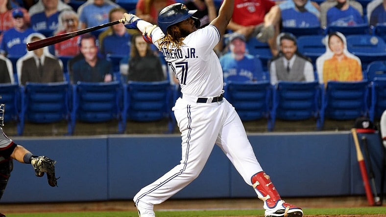 Apr 27, 2021; Dunedin, Florida, CAN; Toronto Blue Jays infielder Vladimir Guerrero Jr. (27) hits a grand slam home run during the third inning against the Washington Nationals at TD Ballpark. Mandatory Credit: Jonathan Dyer-USA TODAY Sports