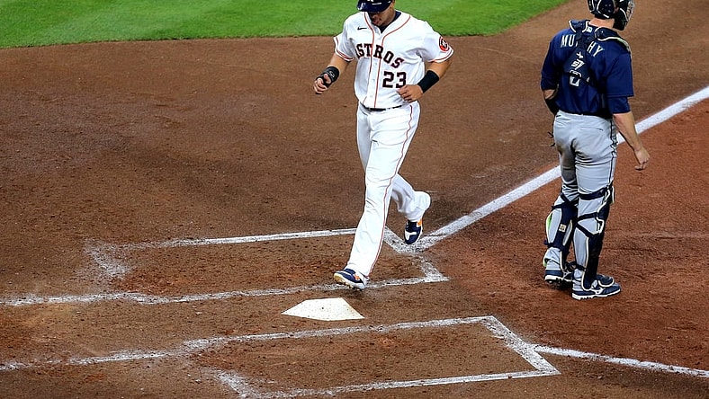 Apr 27, 2021; Houston, Texas, USA; Houston Astros left fielder Michael Brantley (23) scores a run against the Seattle Mariners during the fourth inning at Minute Maid Park. Mandatory Credit: Erik Williams-USA TODAY Sports