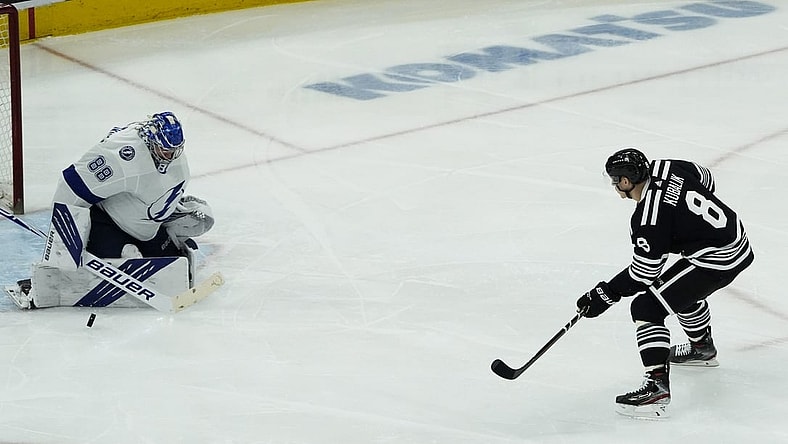 Apr 27, 2021; Chicago, Illinois, USA; Tampa Bay Lightning goaltender Andrei Vasilevskiy (88) makes a save on Chicago Blackhawks left wing Dominik Kubalik (8) during the third period at United Center. Mandatory Credit: David Banks-USA TODAY Sports
