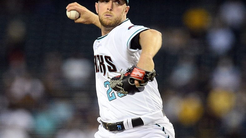 Apr 27, 2021; Phoenix, Arizona, USA; Arizona Diamondbacks starting pitcher Merrill Kelly (29) pitches against the San Diego Padres during the third inning at Chase Field. Mandatory Credit: Joe Camporeale-USA TODAY Sports