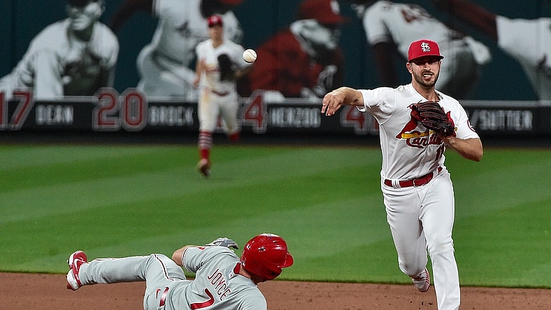 Apr 27, 2021; St. Louis, Missouri, USA;  St. Louis Cardinals shortstop Paul DeJong (11) turns a double play after forcing out Philadelphia Phillies pinch hitter Matt Joyce (7) during the eighth inning at Busch Stadium. Mandatory Credit: Jeff Curry-USA TODAY Sports