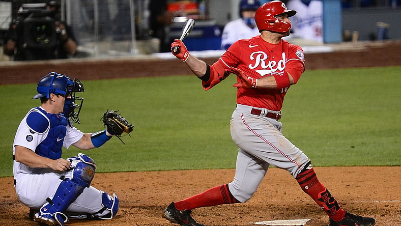 Apr 27, 2021; Los Angeles, California, USA; Cincinnati Reds first baseman Joey Votto (19) hits a two run RBI double against the Los Angeles Dodgers during the seventh inning at Dodger Stadium. Mandatory Credit: Gary A. Vasquez-USA TODAY Sports