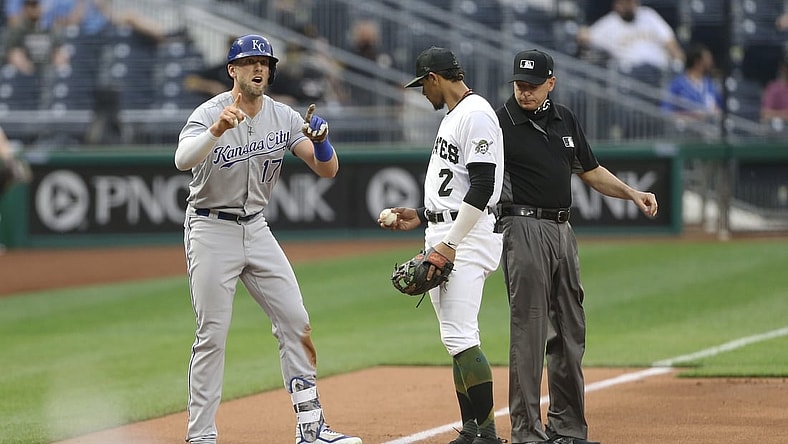Apr 28, 2021; Pittsburgh, Pennsylvania, USA;  Kansas City Royals third baseman Hunter Dozier (17) reacts after hitting a two-run triple against the Pittsburgh Pirates during the first inning at PNC Park. Mandatory Credit: Charles LeClaire-USA TODAY Sports
