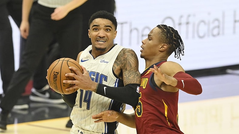 Apr 28, 2021; Cleveland, Ohio, USA; Orlando Magic guard Gary Harris (14) drives against Cleveland Cavaliers forward Isaac Okoro (35) in the second quarter at Rocket Mortgage FieldHouse. Mandatory Credit: David Richard-USA TODAY Sports