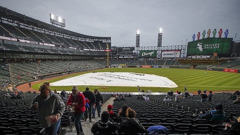 Apr 28, 2021; Chicago, Illinois, USA; Fans leave Guaranteed Rate Field after it was announced that the game between the Chicago White Sox and Detroit Tigers has been postponed due to inclement weather. Mandatory Credit: Kamil Krzaczynski-USA TODAY Sports