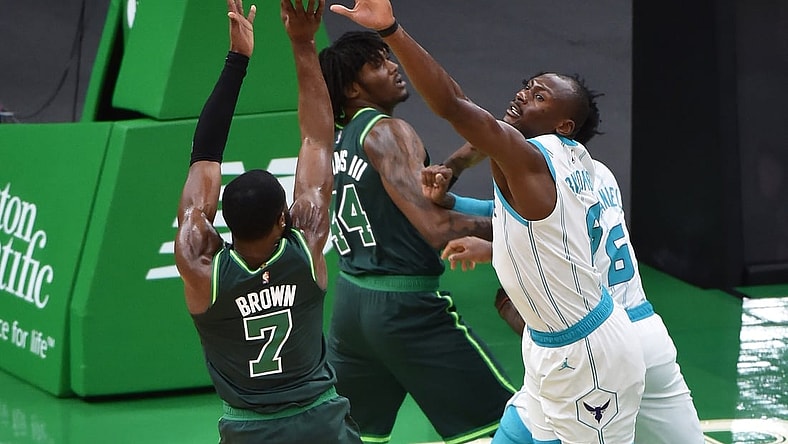 Apr 28, 2021; Boston, Massachusetts, USA;  Boston Celtics guard Jaylen Brown (7) shoots the ball over Charlotte Hornets center Bismack Biyombo (8) during the first half at TD Garden. Mandatory Credit: Bob DeChiara-USA TODAY Sports