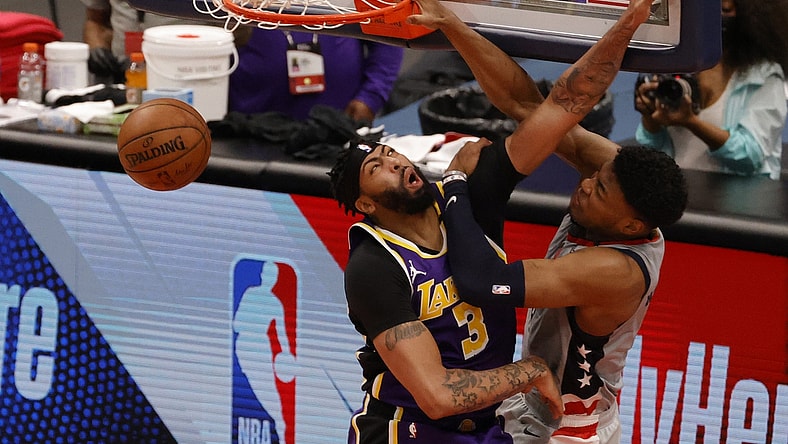 Apr 28, 2021; Washington, District of Columbia, USA; Washington Wizards forward Rui Hachimura (8) dunks the ball over Los Angeles Lakers forward Anthony Davis (3) in the third quarter at Capital One Arena. Mandatory Credit: Geoff Burke-USA TODAY Sports