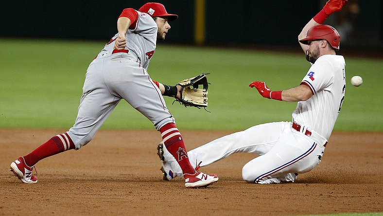Apr 28, 2021; Arlington, Texas, USA; Texas Rangers left fielder David Dahl (21) is caught stealing by Los Angeles Angels second baseman David Fletcher (22) in the third inning at Globe Life Field. Mandatory Credit: Tim Heitman-USA TODAY Sports