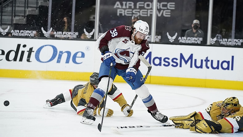 Apr 28, 2021; Las Vegas, Nevada, USA;  Vegas Golden Knights goaltender Marc-Andre Fleury (29) knocks the puck away from Colorado Avalanche center Liam O'Brien (38) during the first period at T-Mobile Arena. Mandatory Credit:  John Locher/POOL PHOTOS-USA TODAY Sports