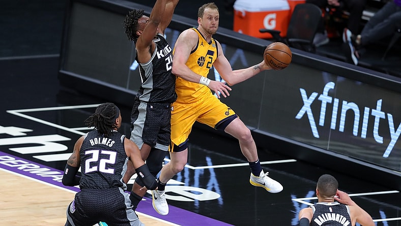 Apr 28, 2021; Sacramento, California, USA; Utah Jazz guard Joe Ingles (2) passes the ball against Sacramento Kings guard Buddy Hield (24) during the first quarter at Golden 1 Center. Mandatory Credit: Sergio Estrada-USA TODAY Sports