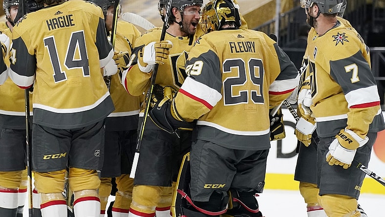 Apr 28, 2021; Las Vegas, Nevada, USA; Vegas Golden Knights defenseman Alec Martinez, center left, celebrates with goaltender Marc-Andre Fleury (29) after defeating the Colorado Avalanche at T-Mobile Arena. Mandatory Credit:  John Locher/POOL PHOTOS-USA TODAY Sports