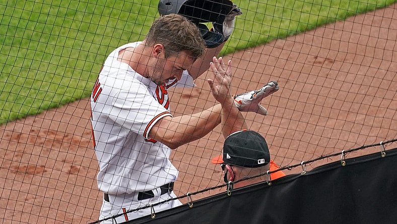 Apr 29, 2021; Baltimore, Maryland, USA;  Baltimore Orioles designated hitter Trey Mancini (16) greeted by teammates after his solo home run in the sixth inning against the New York Yankees at Oriole Park at Camden Yards. Mandatory Credit: Mitch Stringer-USA TODAY Sports