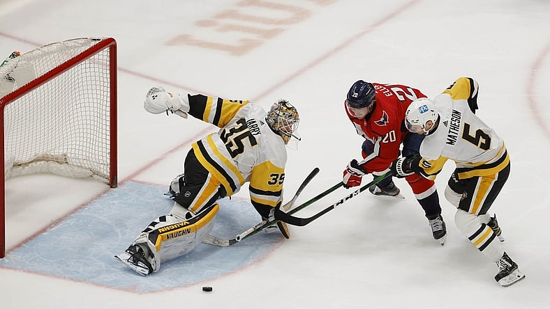 Apr 29, 2021; Washington, District of Columbia, USA; Pittsburgh Penguins goaltender Tristan Jarry (35) makes a save on Washington Capitals center Lars Eller (20) as Penguins defenseman Mike Matheson (5) defends in the first period at Capital One Arena. Mandatory Credit: Geoff Burke-USA TODAY Sports