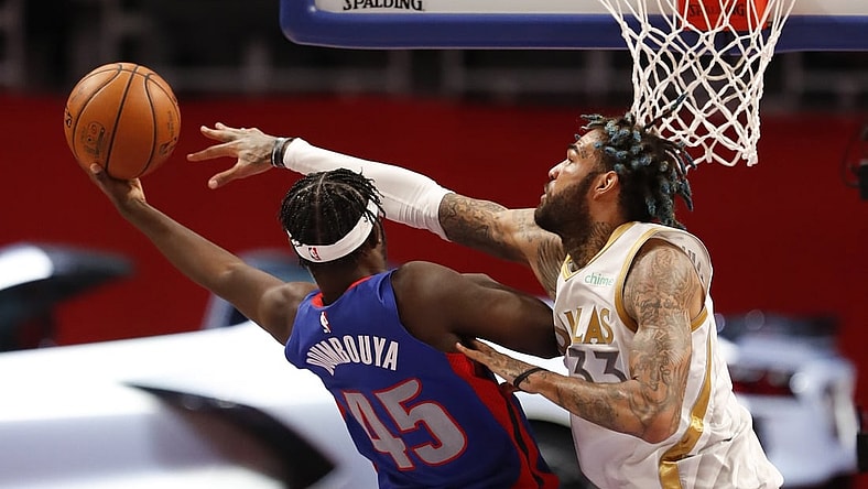 Apr 29, 2021; Detroit, Michigan, USA; Detroit Pistons forward Sekou Doumbouya (45) gets fouled by Dallas Mavericks center Willie Cauley-Stein (33) during the second quarter at Little Caesars Arena. Mandatory Credit: Raj Mehta-USA TODAY Sports