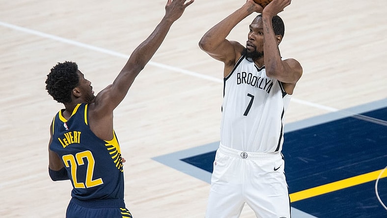 Apr 29, 2021; Indianapolis, Indiana, USA; Brooklyn Nets forward Kevin Durant (7) shoots the ball while Indiana Pacers guard Caris LeVert (22) defends in the third quarter at Bankers Life Fieldhouse. Mandatory Credit: Trevor Ruszkowski-USA TODAY Sports
