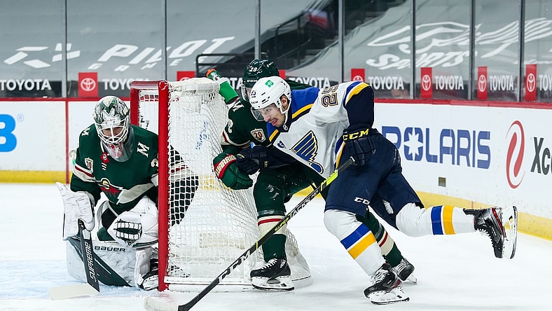 Apr 29, 2021; Saint Paul, Minnesota, USA; Minnesota Wild goaltender Cam Talbot (33) defends his net against St. Louis Blues center Jordan Kyrou (25) while Minnesota Wild defenseman Ian Cole (28) defends in the first period at Xcel Energy Center. Mandatory Credit: David Berding-USA TODAY Sports
