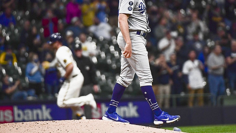 Apr 29, 2021; Milwaukee, Wisconsin, USA;  Los Angeles Dodgers pitcher Trevor Bauer (27) reacts after giving up a two-run home run to Milwaukee Brewers third baseman Travis Shaw (21) in the fourth inning at American Family Field. Mandatory Credit: Benny Sieu-USA TODAY Sports