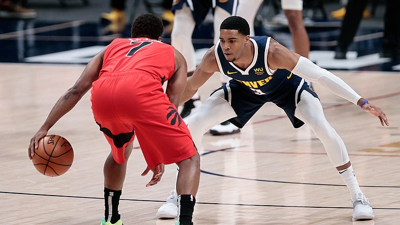 Apr 29, 2021; Denver, Colorado, USA; Toronto Raptors guard Kyle Lowry (7) controls the ball as Denver Nuggets guard Shaquille Harrison (3) guards in the first quarter at Ball Arena. Mandatory Credit: Isaiah J. Downing-USA TODAY Sports