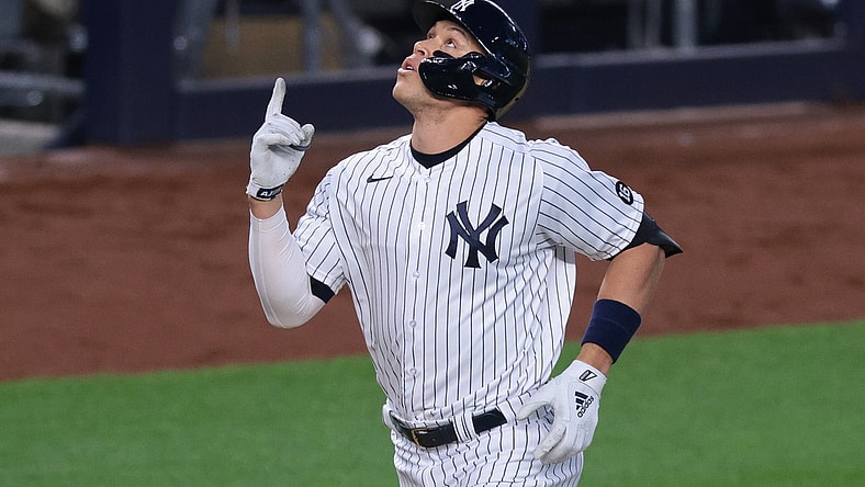 Apr 30, 2021; Bronx, New York, USA; New York Yankees right fielder Aaron Judge (99) celebrates after hitting a home run during the third inning against the Detroit Tigers at Yankee Stadium. Mandatory Credit: Vincent Carchietta-USA TODAY Sports