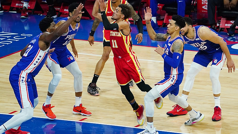 Apr 30, 2021; Philadelphia, Pennsylvania, USA; Atlanta Hawks guard Trae Young (11) goes up for a shot as forward John Collins (behind 11) looks on and Philadelphia 76ers center Joel Embiid (21), forward Tobias Harris (12), forward Danny Green (second from right) and guard Ben Simmons (25) defend in the third quarter at Wells Fargo Center. Mandatory Credit: James Lang-USA TODAY Sports