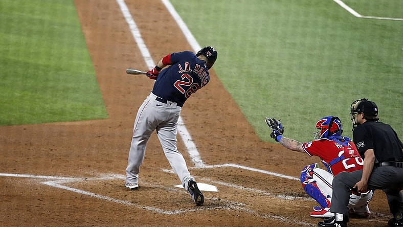 Apr 30, 2021; Arlington, Texas, USA; Boston Red Sox designated hitter J.D. Martinez (28) hits a home run in the third inning against the Texas Rangers at Globe Life Field. Mandatory Credit: Tim Heitman-USA TODAY Sports