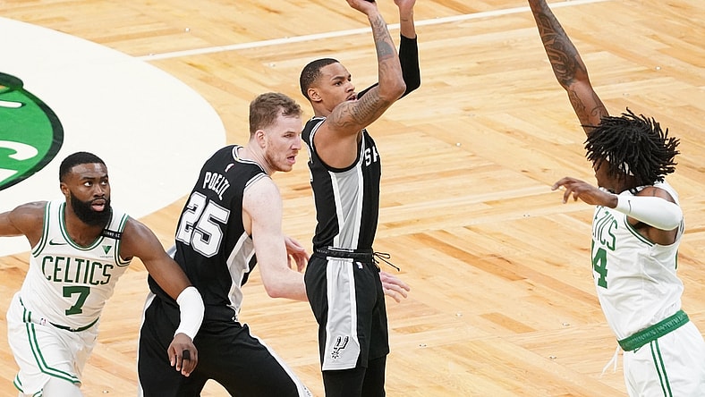 Apr 30, 2021; Boston, Massachusetts, USA; San Antonio Spurs guard Dejounte Murray (5) shoots against Boston Celtics center Robert Williams III (44) in the third quarter at TD Garden. Mandatory Credit: David Butler II-USA TODAY Sports
