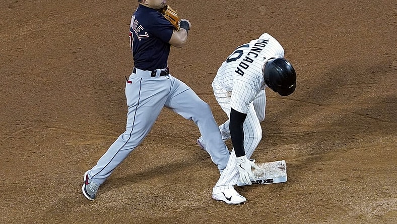 Apr 30, 2021; Chicago, Illinois, USA; Cleveland Indians shortstop Andres Gimenez (0) forces out Chicago White Sox third baseman Yoan Moncada (10) at second base during the fifth inning at Guaranteed Rate Field. Mandatory Credit: David Banks-USA TODAY Sports