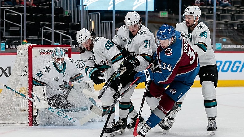 Apr 30, 2021; Denver, Colorado, USA; Colorado Avalanche center Carl Soderberg (34) battles for the puck with San Jose Sharks defenseman Erik Karlsson (65) and defenseman Nikolai Knyzhov (71) and center Tomas Hertl (48) as goaltender Martin Jones (31) defends in the first period at Ball Arena. Mandatory Credit: Isaiah J. Downing-USA TODAY Sports