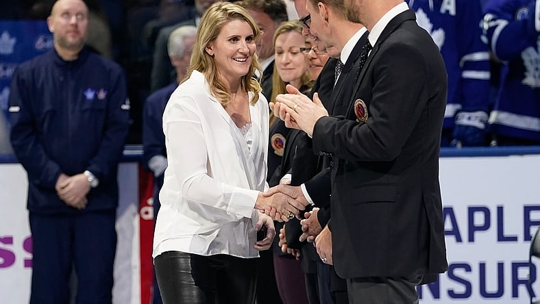 Nov 15, 2019; Toronto, Ontario, CAN; Class of 2019 Hockey Hall of Fame inductee Hayley Wickenheiser shakes hands with hall of famers prior to a game between the Boston Bruins and Toronto Maple Leafs at Scotiabank Arena. Mandatory Credit: John E. Sokolowski-USA TODAY Sports