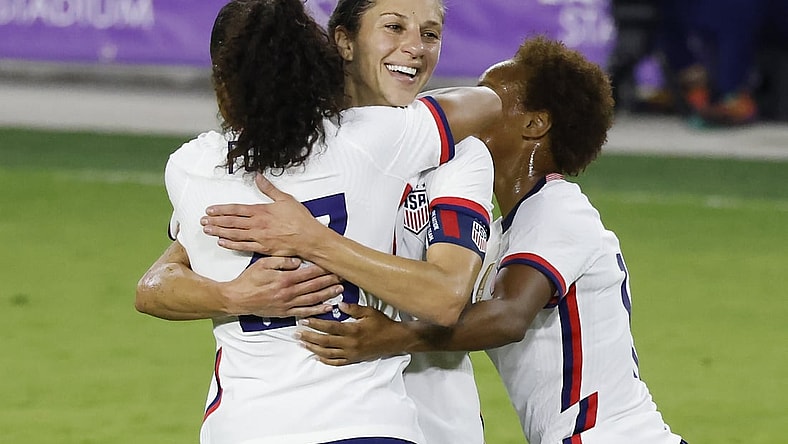 Jan 22, 2021; Orlando, Florida, USA;  United States forward Carli Lloyd (10) gets a congratulations from defender Margaret Purce (23) and midfielder Lindsey Horan (9) following her goal against Colombia during the second half at Exploria Stadium. Mandatory Credit: Reinhold Matay-USA TODAY Sports
