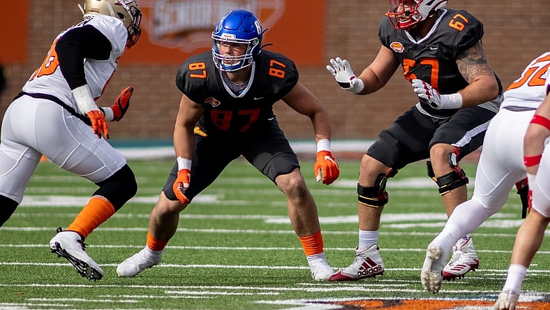 Jan 30, 2021; Mobile, AL, USA; National tight end John Bates of Boise State (87) and National offensive lineman Brenden Jaimes of Nebraska (67) and American linebacker Janarius Robinson of Florida State (96) in the first half of the 2021 Senior Bowl at Hancock Whitney Stadium. Mandatory Credit: Vasha Hunt-USA TODAY Sports