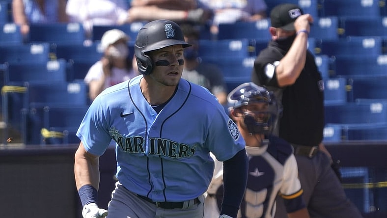 Mar 21, 2021; Phoenix, Arizona, USA; Seattle Mariners centerfielder Jarred Kelenic (10) hits a homerun against the Milwaukee Brewers during a spring training game at American Family Fields of Phoenix. Mandatory Credit: Rick Scuteri-USA TODAY Sports