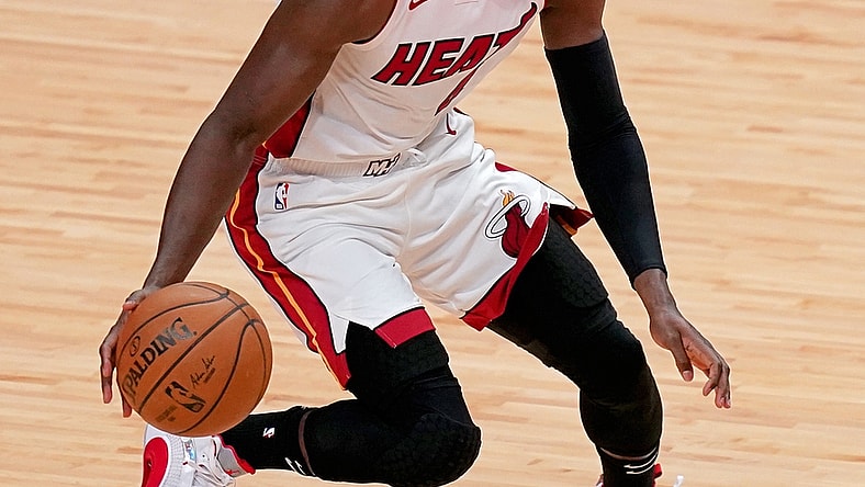 Apr 6, 2021; Miami, Florida, USA; Miami Heat guard Victor Oladipo (4) dribbles the ball up the court against the Memphis Grizzlies during the first half at American Airlines Arena. Mandatory Credit: Jasen Vinlove-USA TODAY Sports
