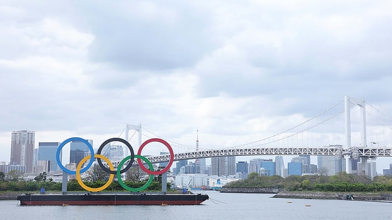 Apr 6, 2021; Tokyo, JAPAN; General view of the Olympic rings sculpture, Rainbow Bridge, and Tokyo Tower as seen from Odaiba in preparation for the Tokyo 2020 Olympic Summer Games set to begin in July 2021. Mandatory Credit: Yukihito Taguchi-USA TODAY Sports
